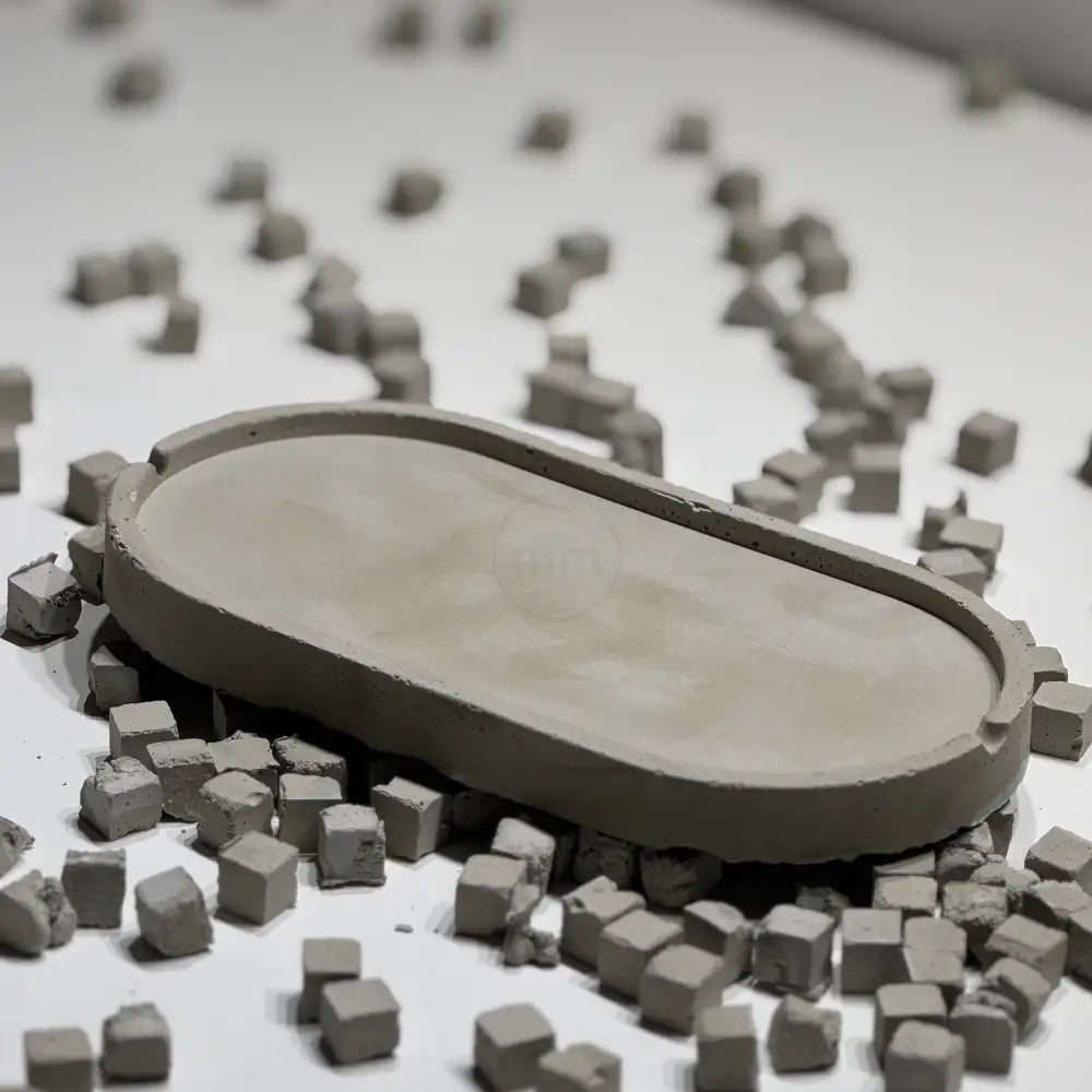 Concrete oval tray with architectural elongated shape