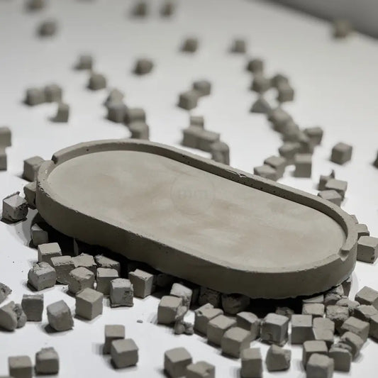 Concrete oval tray with architectural elongated shape